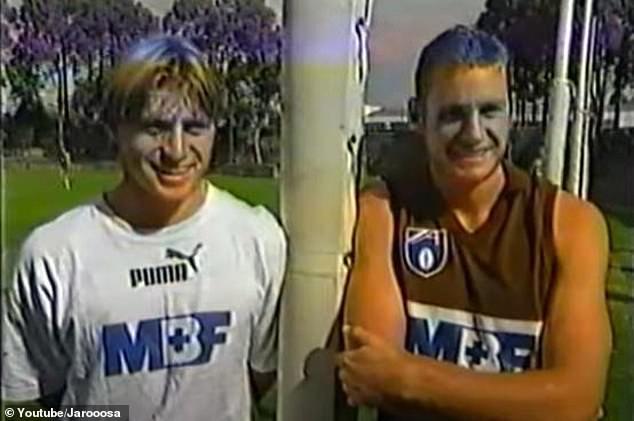 Crawford (left) giving an interview with his brother Justin (right) when the two played together at Hawthorn