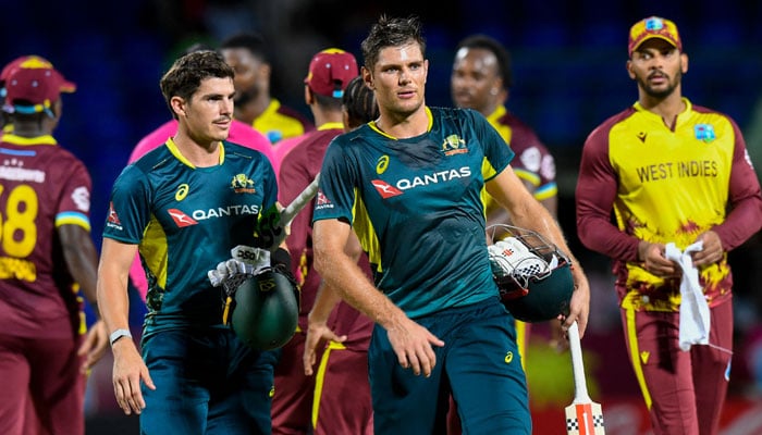 Australias Sean Abbott (Right) And Aaron Hardie (Left) Walk Off The Field After Winning The Fifth T20I Against West Indies At Warner Park Sporting Complex In Basseterre, Saint Kitts And Nevis, On July 28, 2025. — Afp