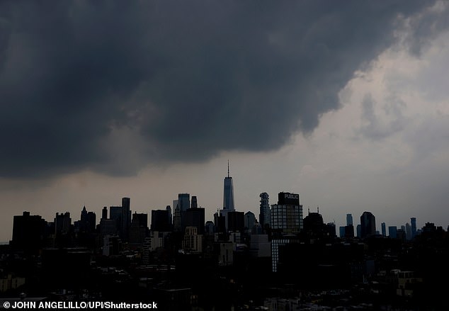 An eerie storm cloud looms over the Manhattan skyline as it threatens New York City