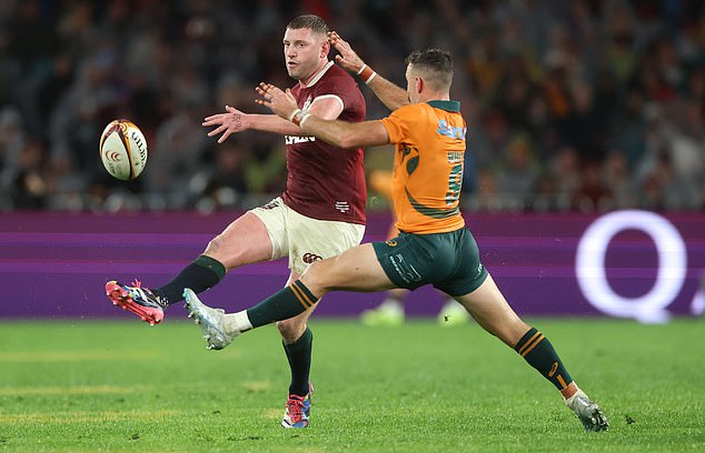 Sydney, Australia - August 02: Finn Russell Of The British &Amp; Irish Lions Kicks The Ball Whilst Under Pressure From Nic White Of Australia During The Third Test Of The Series Between Australia Wallabies And British &Amp; Irish Lions At Accor Stadium On August 02, 2025 In Sydney, Australia. (Photo By David Rogers/Getty Images)