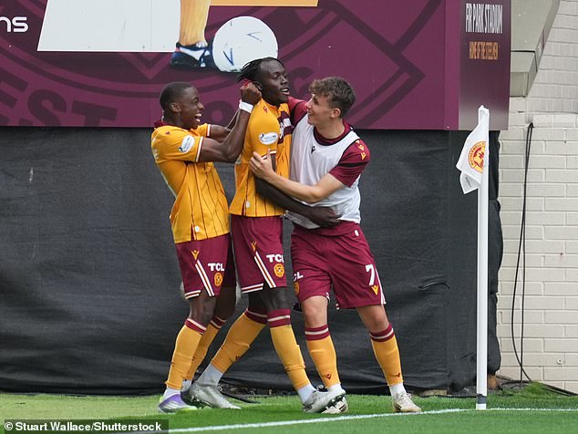Home Hero Longelo (Centre) Is Hailed By Team-Mates After Netting The Equaliser