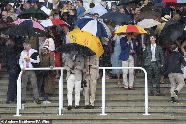 The Rain Piles Down On The Crowd In A Dramatic Thursday Of The Festival At The Sussex Downs