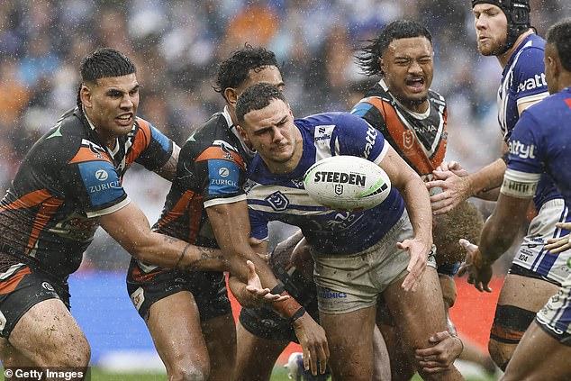 Dogs Star Jacob Kiraz (Centre) Was Also Photographed Directing The Offensive Hand Gesture At Tigers Star Adam Doueihi Before The Match On Sunday