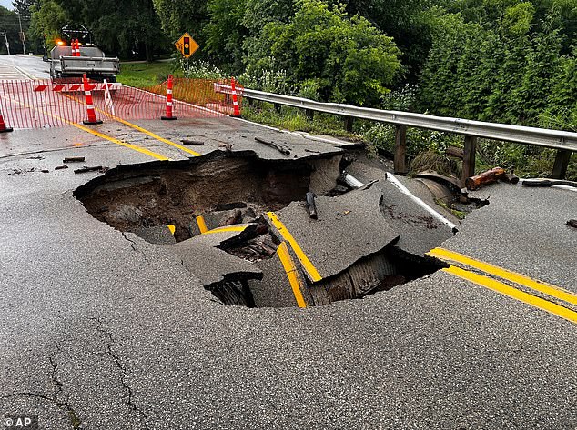 This Image Provided By Cbs28 (Wdjt) Shows A Damaged Street As A Result Of Flooding