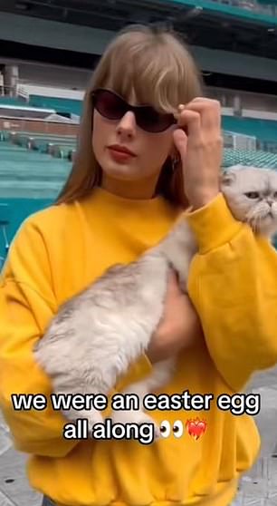 She Was Holding A Cat And Wearing An Orange Sweater