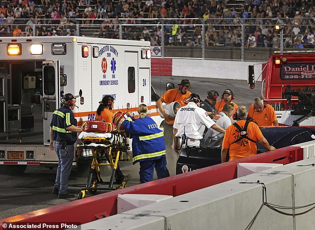 Crew Work To Remove The Sportsman Series Driver From His Car After The Medical Emergency