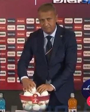 Footage then showed him placing the ball underneath another