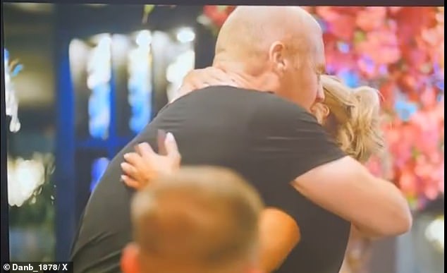 The pair, who are seemingly pals, exchanged and hug and a kiss before the manager got back to his food