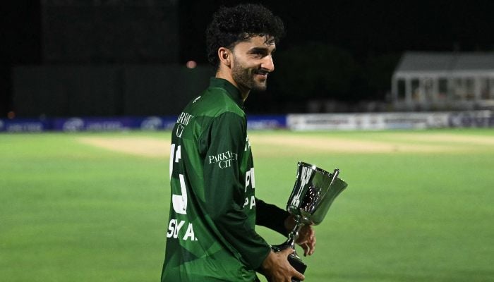 Sufiyan Muqeem Holds The Champion Trophy After His Team Won The Third T20I, Sealing A 2-1 Series Victory Over West Indies, At Central Broward Park &Amp; Broward County Stadium In Lauderhill, Florida, On August 3, 2025. — Afp