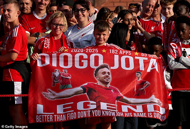 Fans held up flags at Anfield as they paid their respects to a popular figure around the club