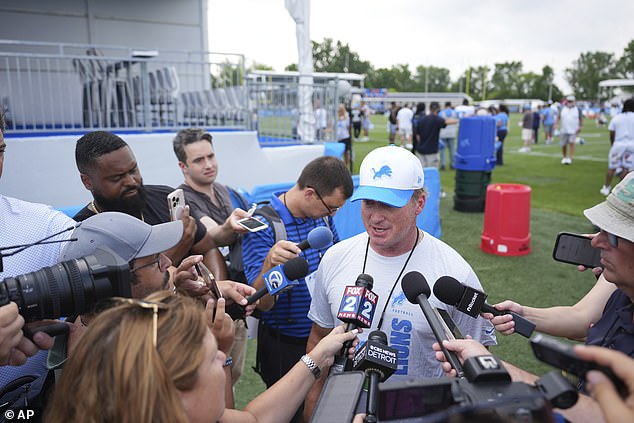 Jon Gruden Speaks To The Media While Visiting The Detroit Lions' Training Camp Last Month