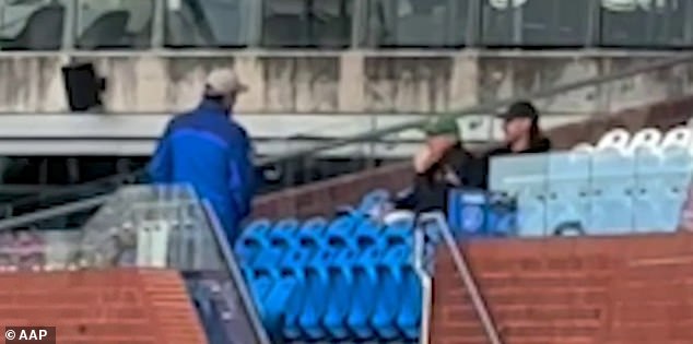 Tension between the Western Bulldogs and Fremantle could boil over this weekend after Dockers ruck and development coach Sam Naismith (right, wearing black cap) was busted spying on his rivals on Friday in Melbourne