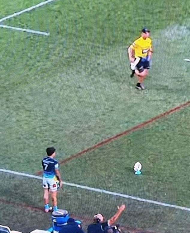 Pictured: The Moment Penrith Trainer Corey Bocking Ran In Front Of Gold Coast's Jayden Campbell As He Prepared To Take A Conversion Kick That Could Have Won The Match For His Team