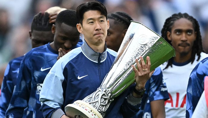 Tottenham Hotspurs South Korean Forward Son Heung-Min Carries The Europa League Trophy As He And The Team Display It For Fans Following The English Premier League Football Match Between Tottenham Hotspur And Brighton And Hove Albion At The Tottenham Hotspur Stadium In London, On May 25, 2025. — Afp
