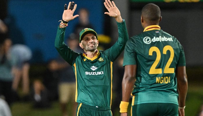 South Africas Keshav Maharaj (Left) Celebrates Victory With Lungi Ngidi After The Dismissal Of Australias Adam Zampa During The First One-Day International (Odi) Cricket Match Between Australia And South Africa At Cazalys Stadium In Cairns On August 19, 2025. — Afp