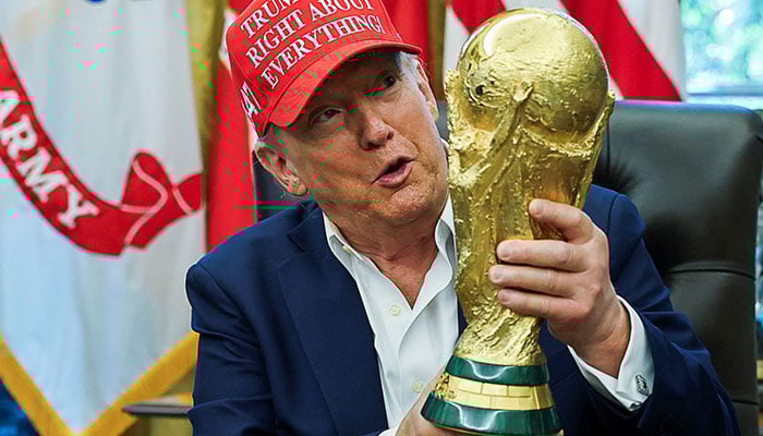 Us President Donald Trump Wears A Trump Was Right About Everything! Hat While Holding The Fifa World Cup Trophy, As He Announces The 2026 Fifa World Cup, In The Oval Office At The White House In Washington, Dc, Us, August 22, 2025. — Reuters