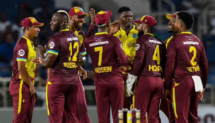 West Indies Alzarri Joseph (Centre) Celebrates With Teammates After Dismissing Australias Mitchell Marsh During Their First T20I At Sabina Park In Kingston, Jamaica On July 20, 2025. — Afp