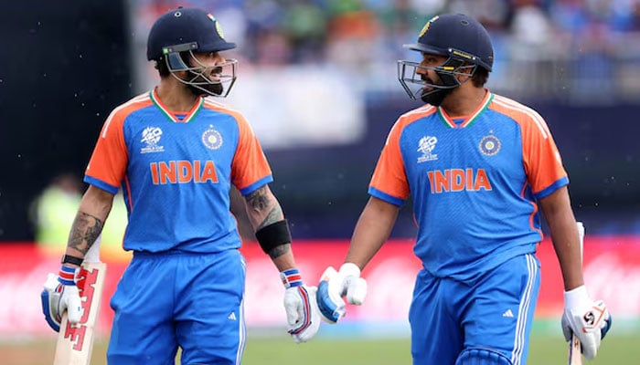 Indias Rohit Sharma And Virat Kohli Leave The Pitch Due To Rain During Icc T20 World Cup 2024 - Group A Match Against Pakistan At Nassau County International Cricket Stadium, New York, United States On June 9, 2024. — Reuters