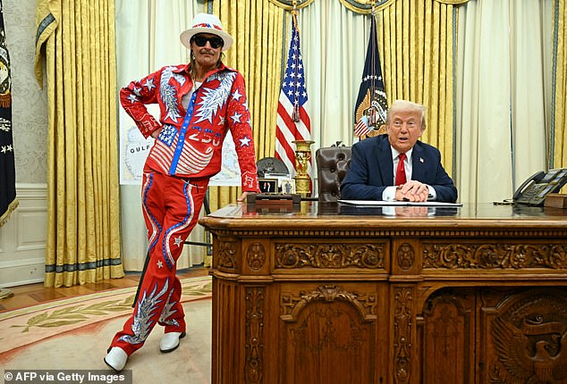 President Donald Trump Signs An Executive Order Alongside Us Singer Kid Rock In The Oval Office Of The White House In Washington, Dc, On March 31, 2025