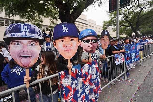 Other Fans Held Up Huge Images Of Their Favorite Players' Heads On Sticks At The Parade