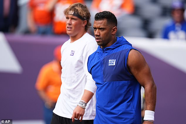 Russell Wilson Warms Up Alongside Giants Rookie Jaxson Dart Before An October 19 Game