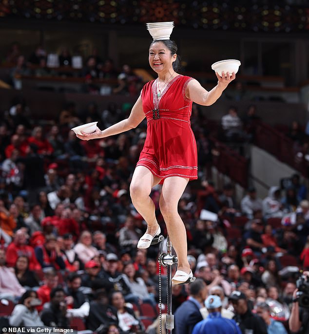Her Routine Is Riding A Unicycle, Flicking Bowls Up With Her Feet And Balancing Them On Her Head