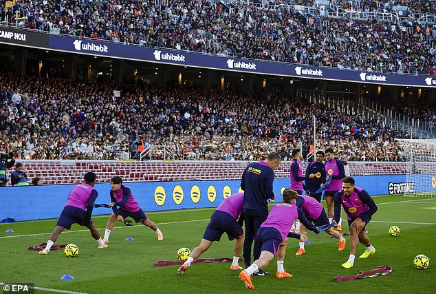 Fans In Club Merchandise Have Arrived To Watch The Players As They Bask In The Barcelona Sun