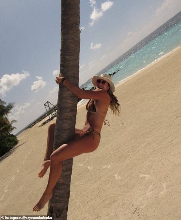 Sabalenka even made sure to reconnect with nature - hilariously hugging a tree on the beach
