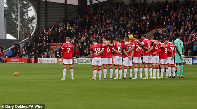 The Wrexham Star Last Year Stood Separate To His Team-Mates Observing A Moment Of Silence