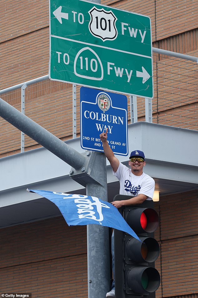 Some Are Even Scaling Traffic Lights As They Look To Grab The Best View Of The Parade On Monday