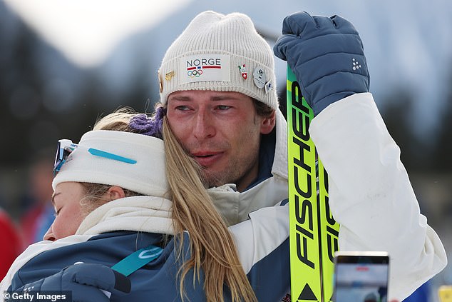 Sturla Holm Laegreid Is Embraced By Norwegian Team-Mate Ingrid Landmark Tandrevold