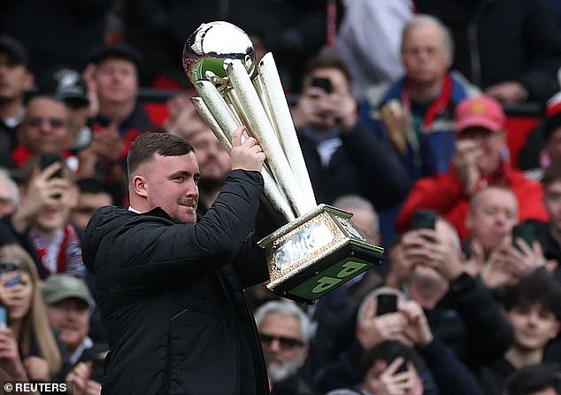 Luke Littler Takes To The Pitch At Half-Time Of Saturday's Win Over Spurs To Parade His World Darts Championship Trophy After Winning The Title For A Second Time