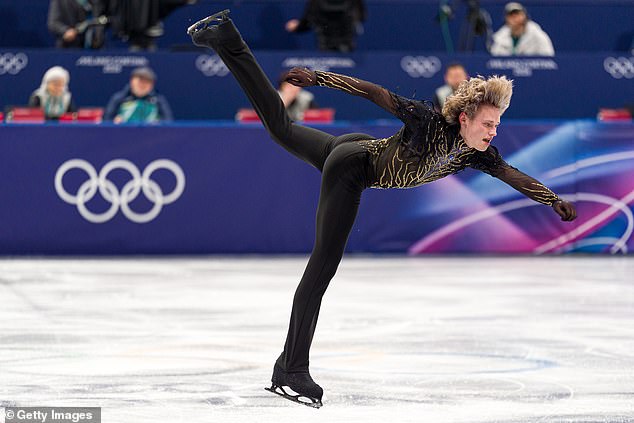 Ilia Malinin, 21, Delivered A Crucial Performance In Milan On Sunday Night, Packing His With Trademark Quadruple Jumps Before Punctuating It With A Dramatic Backflip, And Landing On Just One Skate