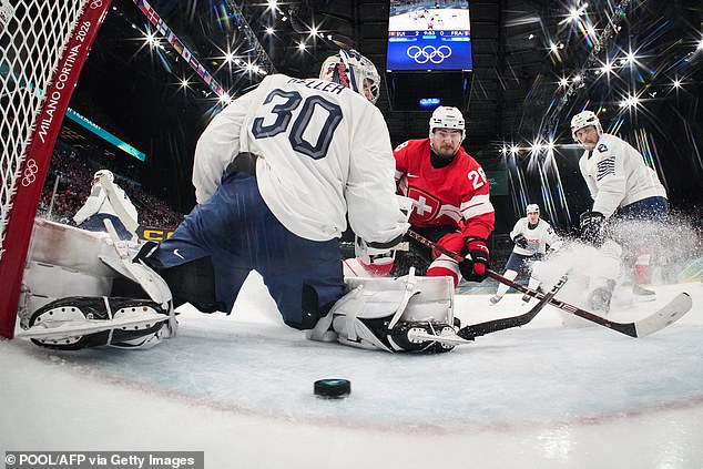 Switzerland's #28 Timo Meier (C) Shoots And Scores His Team Third Goal During The Men's Preliminary Round Group A Ice Hockey Match Between Switzerland And France