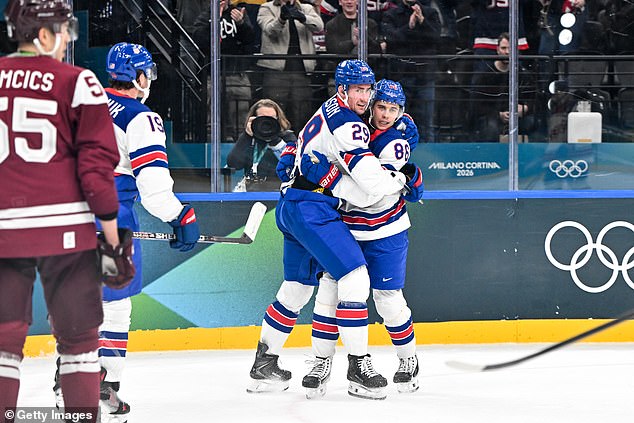 Brock Nelson Hugs Jack Hughes After Scoring The Tie-Breaking Goal Against Latvia