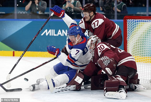Brady Tkachuk Is Taken Down In Front Of The Latvia Net In What Proved To Be A Physical Game
