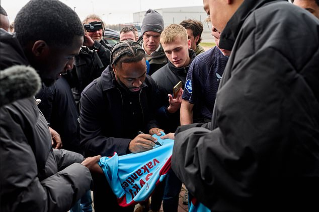 The Former Chelsea And England Star Signed Shirts And Looked In Good Spirits After Landing