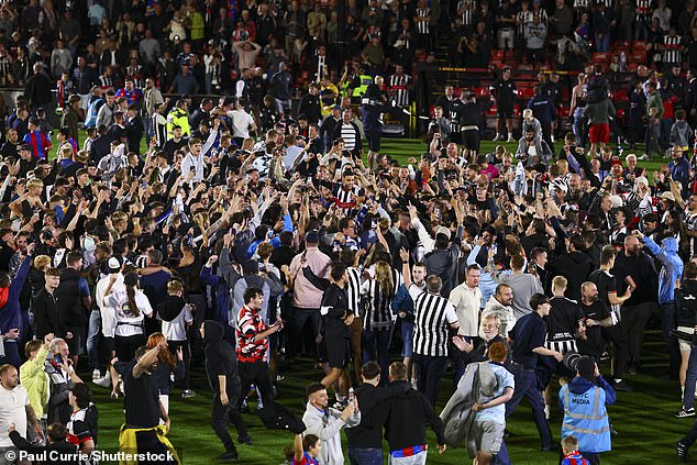 Thousands Of Fans Flooded The Pitch At Blundell Park After Pulling Off The Upset Over Man United