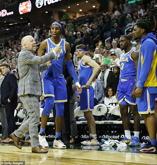 Bruins Players Watch As Teammate Steven Jamerson Ii Is Ushered To The Locker Room
