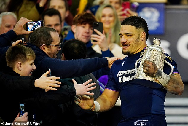 Tuipulotu Is Congratulated By Delighted Fans As He Carries Calcutta Cup Onto The Pitch
