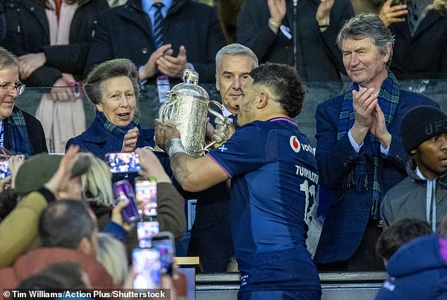 Princess Anne Presents The Trophy To A Proud Tuipulotu After Last Weekend's Victory