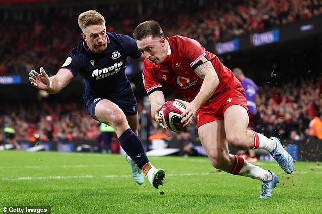 Josh Adams Of Wales Dives In To Score His Team's Second Try Against Scotland In Cardiff