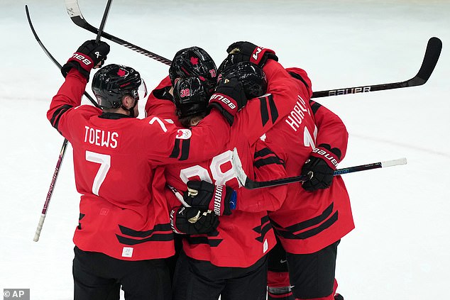 The Canadians Celebrate Their Equalizer, Setting Up A Gripping Third Period For The Gold Medal