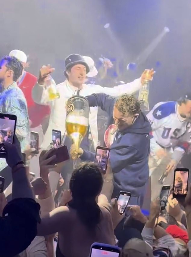 Matthew Tkachuk Pours Alcohol On Fans As Zach Werenski Stands With His Arms Spread Open