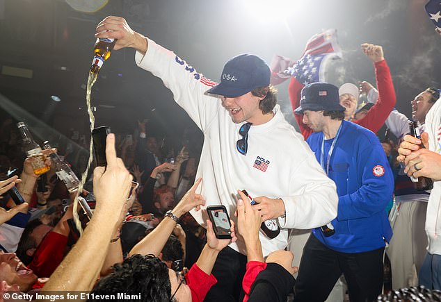 Jack Hughes Is Pictured Sharing His Beer With Some Onlookers In Miami With His Brother, Quinn, Standing Behind Him. The Team Was Celebrating Their Gold Medal Victory At E11Even Miami