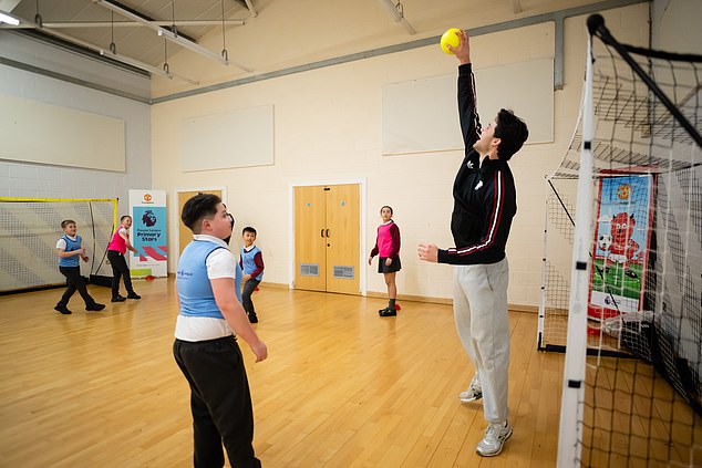 Lammens Is Seen Playing Football In A Sports Hall With Children In Manchester