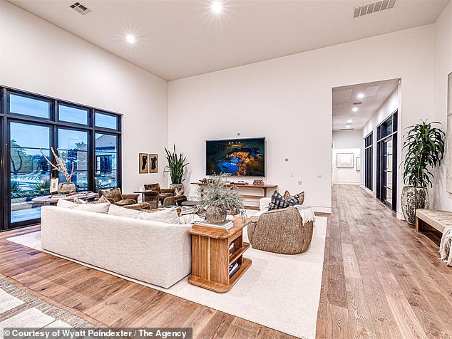 A Look Inside The Living Room Of The Property Which Boasts A Hardwood Finish