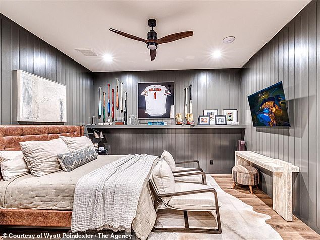 An Insight Into One Of The Property's Bedrooms, Which Features Some Holliday Memorabilia