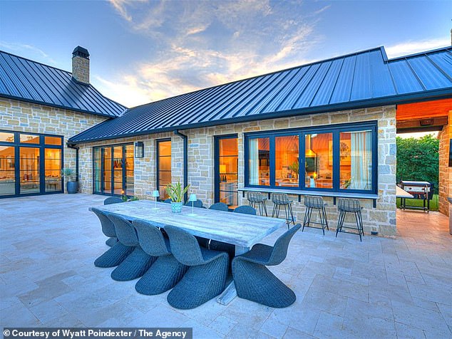 A View Of The Outside Patio And Dining Area Which Boasts A Stunning, Sleek Finish