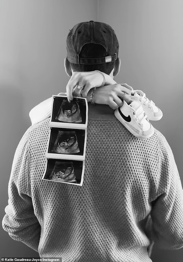 'Our Favorite News To Share,' Katie Captioned The Black-And-White Video Showing The Couple Embracing As She Dangled An Array Of Ultrasound Images From Her Hand